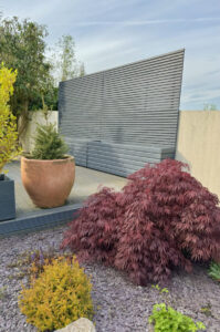 contemporary trellis fence panels in a light grey wood finish